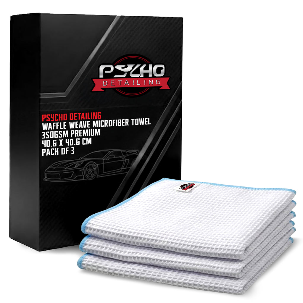 Stack of waffle weave microfiber towels with packaging displaying 'Psycho Detailing' brand.