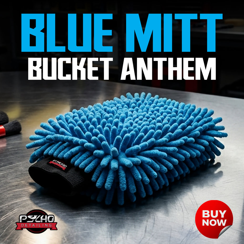 Blue microfiber mitt with 'Blue Mitt Bucket Anthem' text and Psycho Detailing logo on a metallic surface.